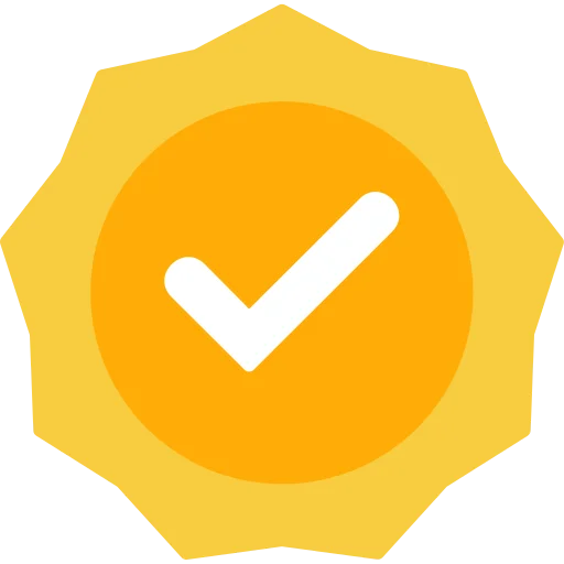 A yellow badge featuring a prominent tick mark, symbolizing approval or completion.